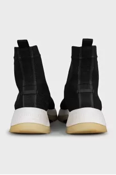 Black textile sneakers with a white sole