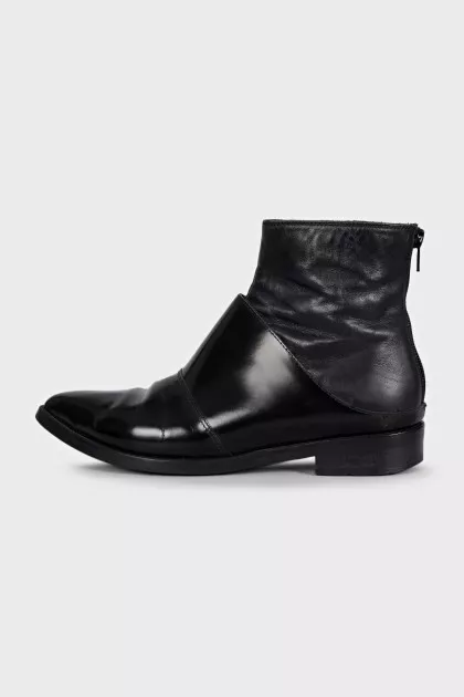 Black leather pointed toe boots