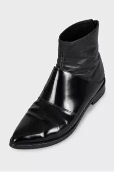 Black leather pointed toe boots