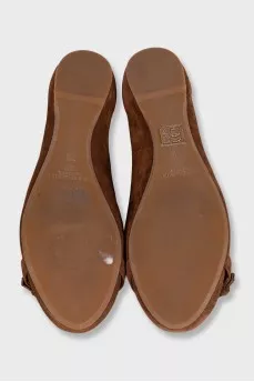 Brown suede ballet flats with a silver buckle