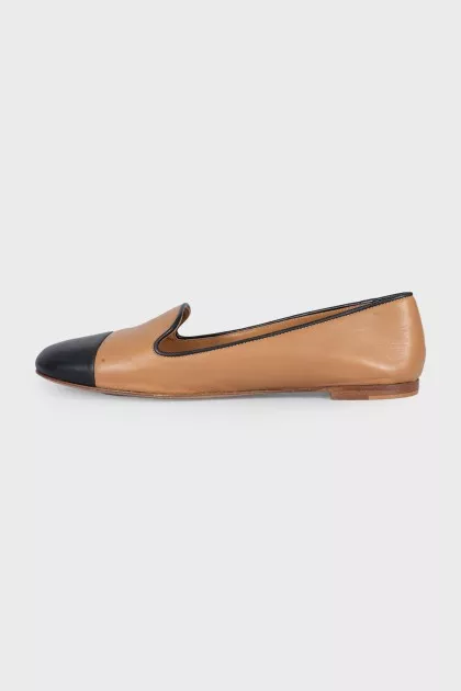 Brown leather ballet flats with black toe