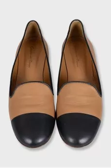 Brown leather ballet flats with black toe