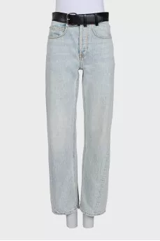 Light blue straight-leg jeans with a black belt