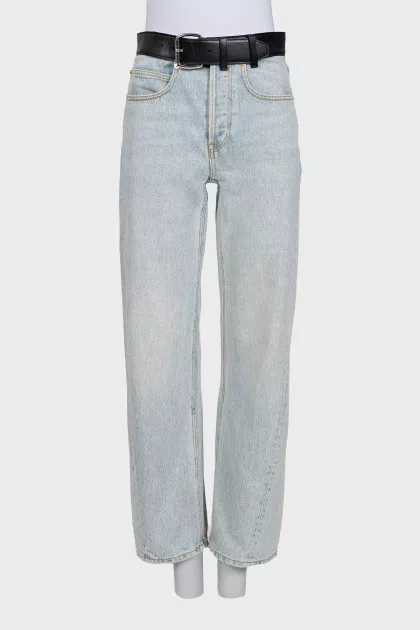 Light blue straight-leg jeans with a black belt