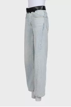 Light blue straight-leg jeans with a black belt