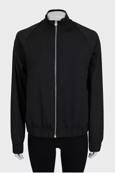 Black bomber jacket with a silver zipper