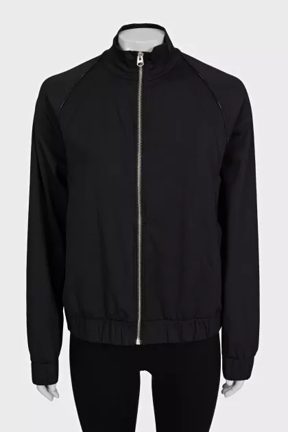 Black bomber jacket with a silver zipper