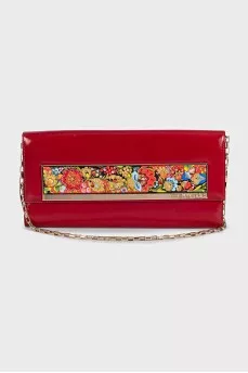 Red leather clutch decorated with enamel