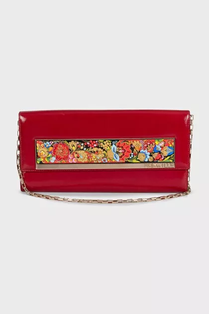 Red leather clutch decorated with enamel
