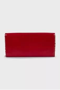 Red leather clutch decorated with enamel