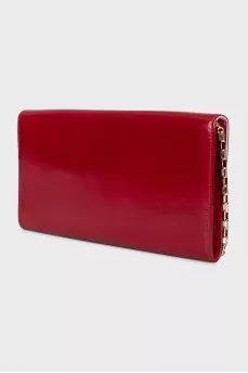 Red leather clutch decorated with enamel