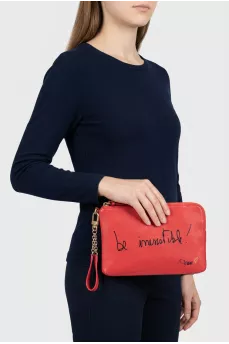 Leather clutch decorated with inscription
