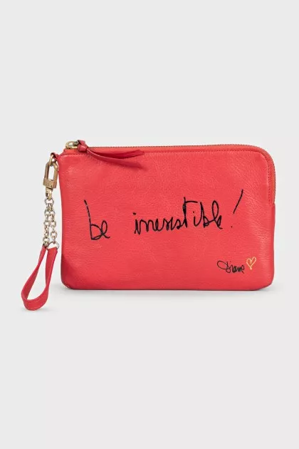 Leather clutch decorated with inscription