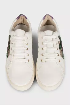 White leather sneakers decorated with sequins