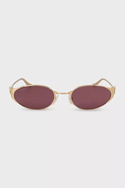 Sunglasses with purple lenses and gold frames