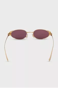 Sunglasses with purple lenses and gold frames