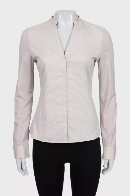 Beige fitted blouse with long sleeves