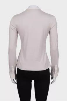 Beige fitted blouse with long sleeves
