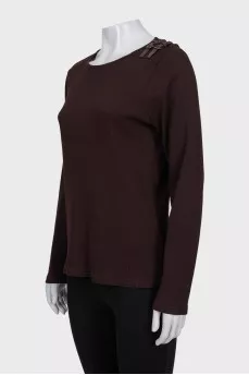Dark brown long sleeve top with buckles on the shoulder