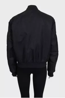 Black loose-fitting bomber jacket with a zipper