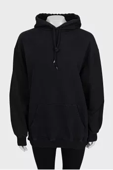 Black loose-fitting hoodie with logo