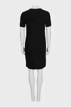 A straight-cut dress decorated with pleats