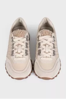 Beige leather sneakers with fur trim