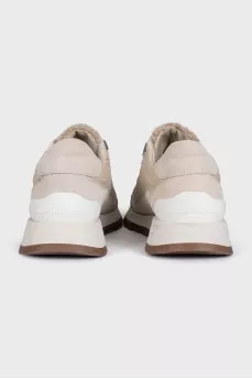 Beige leather sneakers with fur trim