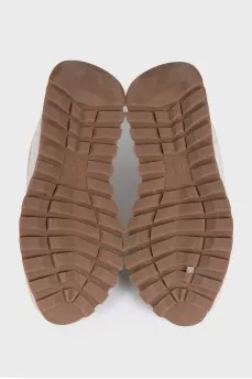 Beige leather sneakers with fur trim