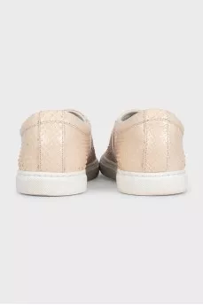 Beige leather slip-ons with embossing