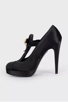 Black textile shoes decorated with a flower