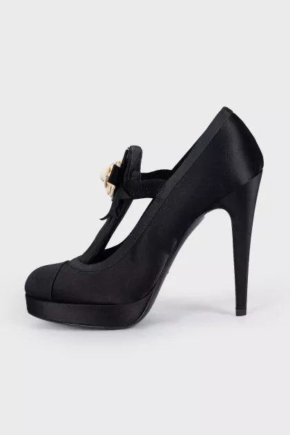 Black textile shoes decorated with a flower