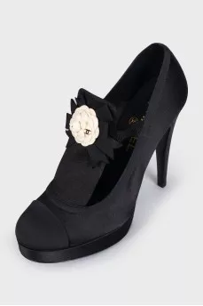 Black textile shoes decorated with a flower