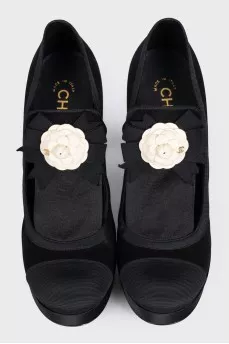 Black textile shoes decorated with a flower