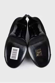 Black textile shoes decorated with a flower