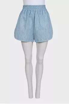 Light blue shorts with elastic waistband and pockets