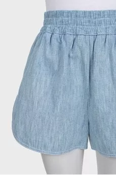 Light blue shorts with elastic waistband and pockets