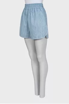 Light blue shorts with elastic waistband and pockets