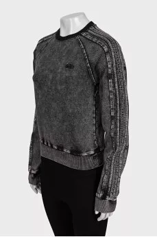 Gray sweatshirt with a distressed effect