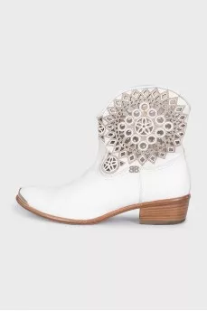 White leather Cossack boots decorated with perforations