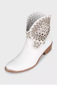 White leather Cossack boots decorated with perforations