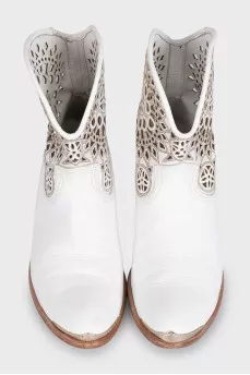 White leather Cossack boots decorated with perforations