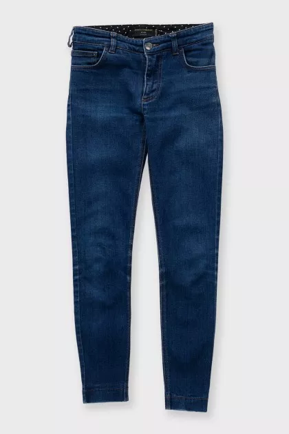 Blue skinny fit jeans with silver hardware