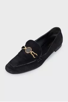 Black suede loafers with gold trim