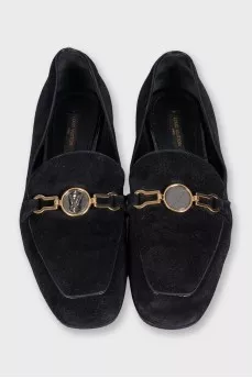 Black suede loafers with gold trim