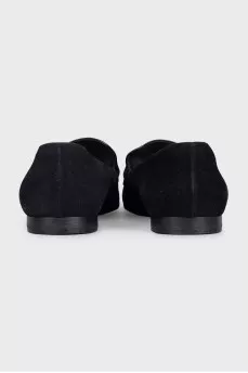 Black suede loafers with gold trim