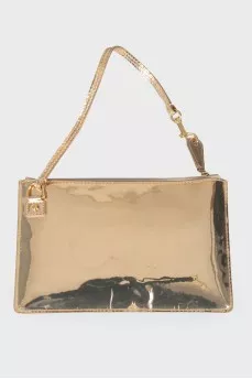 Golden clutch from a brand's logo