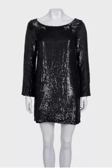 Black dress decorated with sequins with long sleeves