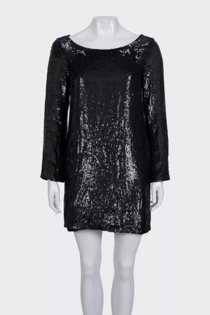 Black dress decorated with sequins with long sleeves