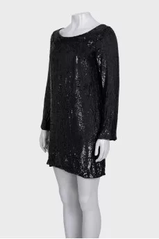 Black dress decorated with sequins with long sleeves